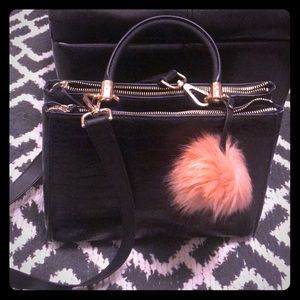 Business casual black handbag with pink pom Pom